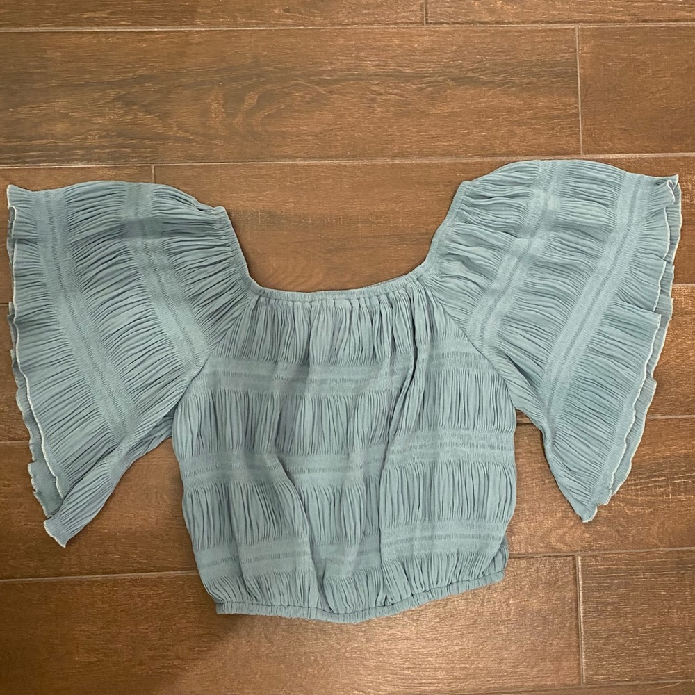 Blue off the shoulder cropped shirt. Size Medium, Worn Once